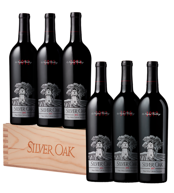 an image of two bottles one in a silver oak cloth case and another wine bottle without the wine case